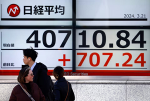 screen displaying Japan's Nikkei share average outside a brokerage in Tokyo, Japan March 21, 2024